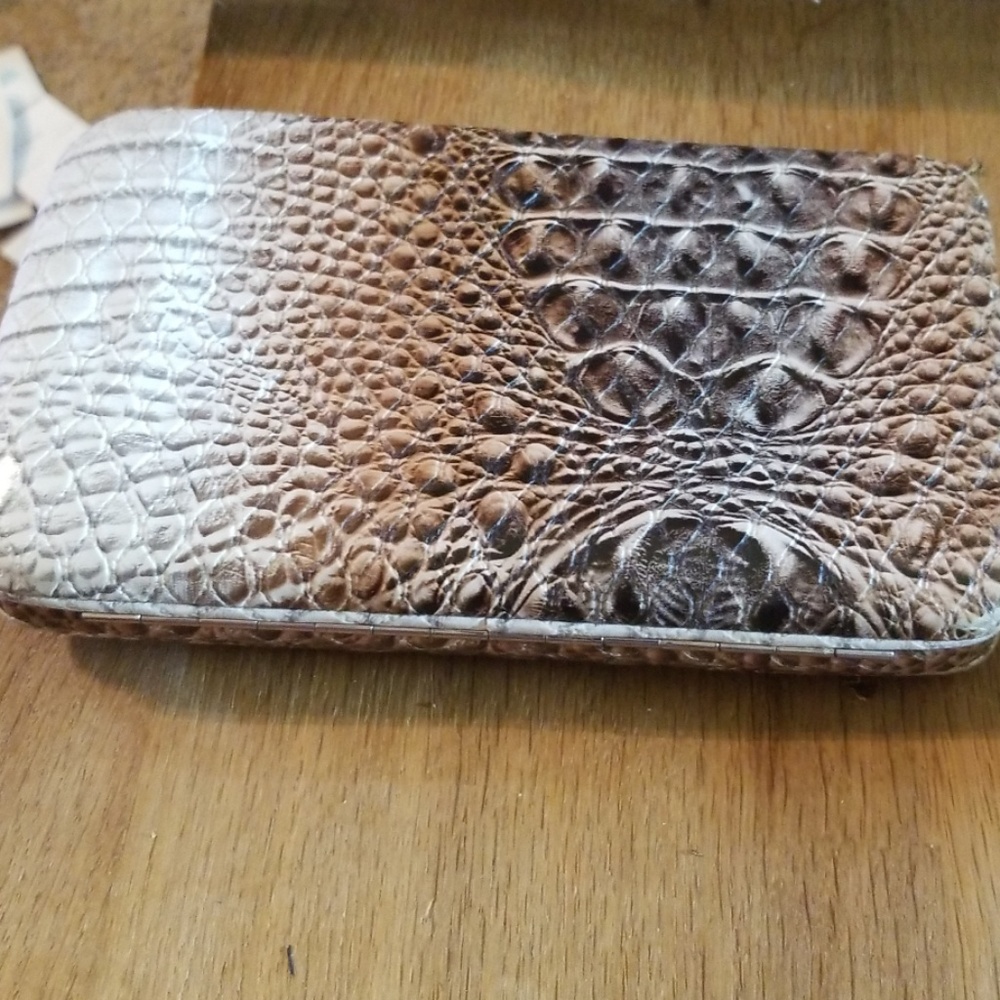 Snap leather wallet with alligator texture.